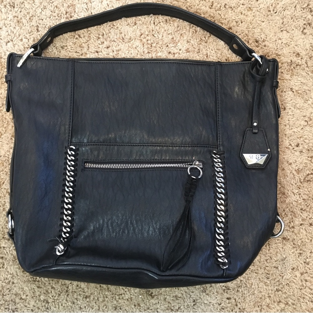 Jessica Simpson tote/purse in faux leather with silver logos and silver accents.
